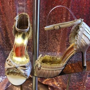 Champagne patent, ruffle heels.